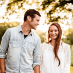 man and women holding hands and smiling